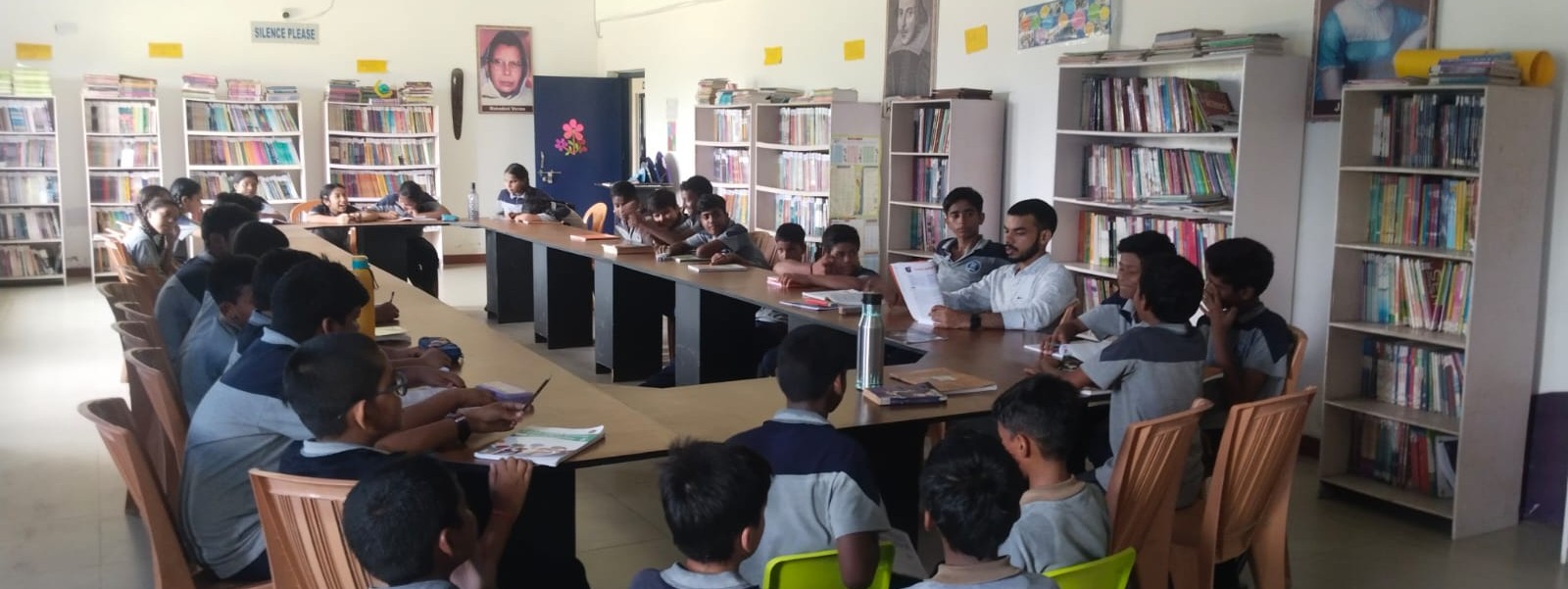 Students having an active group discussion in the library