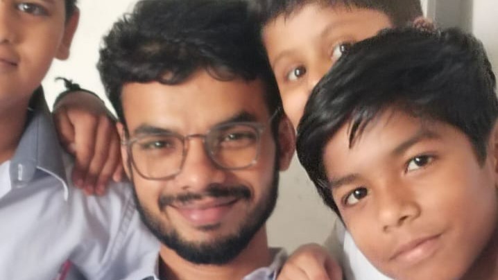 Teacher smiling with confident students